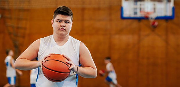 boy playing basketball